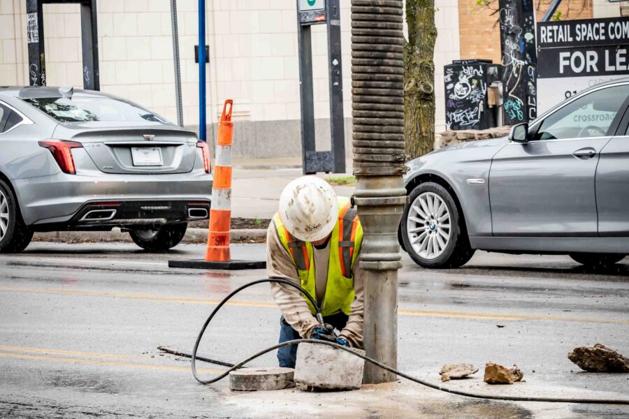 NG Companies employee using hydrovac on the street