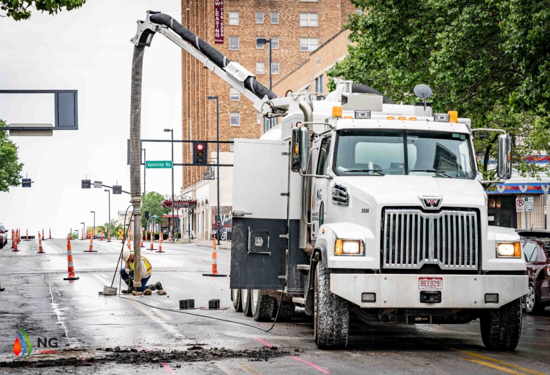 NG Companies employee using hydrovac truck on street