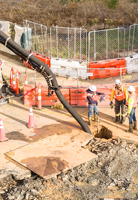 NG Companies employees next to hydrovac on a worksite