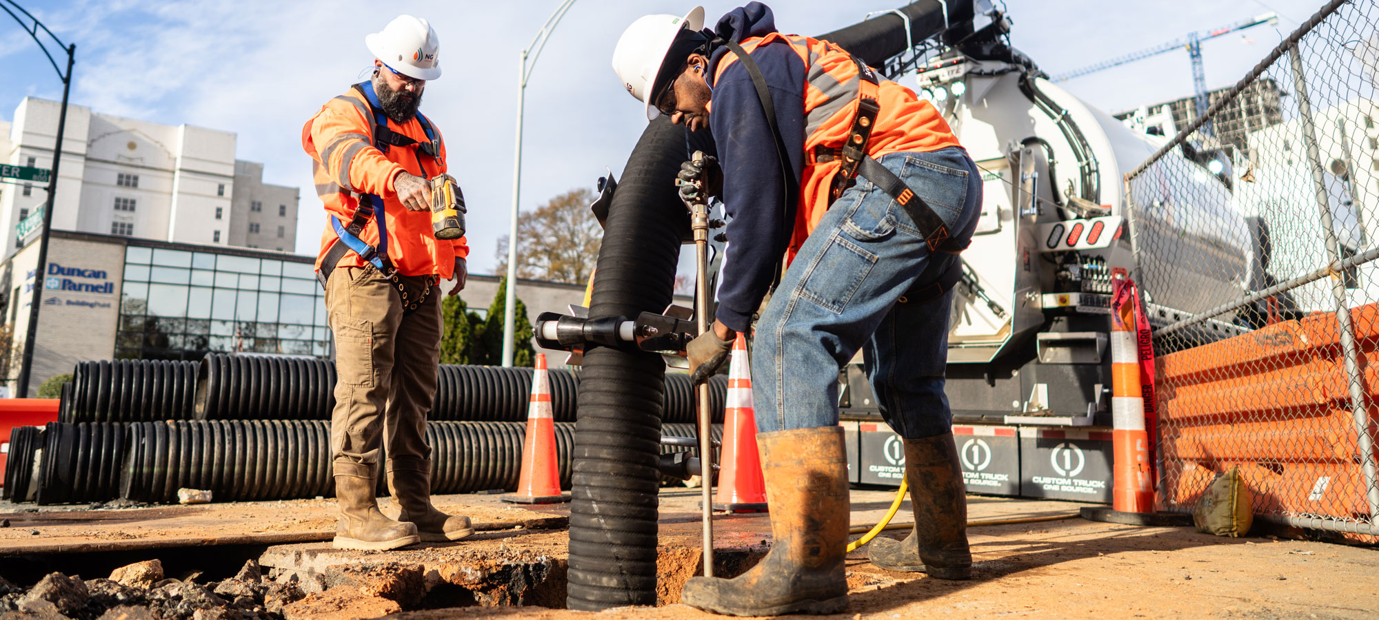 ng workers performing hydrovac excavation on utility emergency